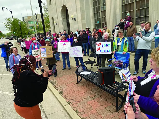Shatriya Smith, at left, executive director of the Garvey-Tubman Cultural Arts and Research Center, speaks at a rally of pro-choice supporters May 3 outside the Paul Findley Federal Building & U.S. Courthouse in Springfield. - PHOTO BY DEAN OLSEN