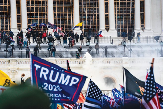 Supporters of former President Donald Trump clash with the U.S. Capitol police during a riot at the Capitol on Jan. 6, 2021. - PHOTO BY ALEX EDELMAN/AFP/GETTY IMAGES/TNS.