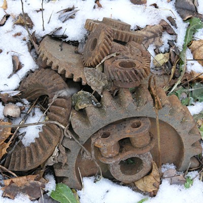 an assortment of used gears and a link