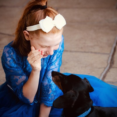 Just a little girl and her best friend telling “ secrets” .