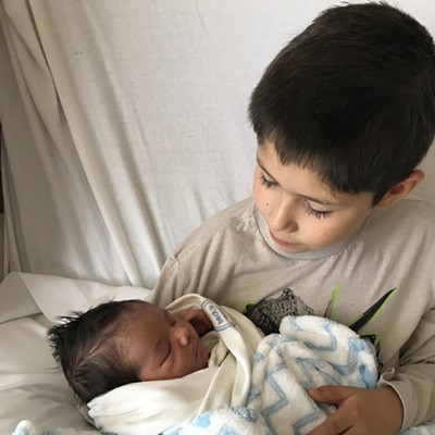 Big brother holding baby brother