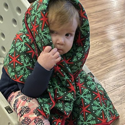 14 month old wrapped blanket around her and and sat down quietly