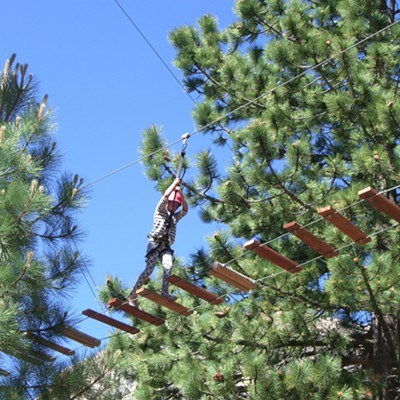 Makayla Dougherty, 8, crossing a bridge on the ropes course at Lake Tahoe, June 24, 2016.