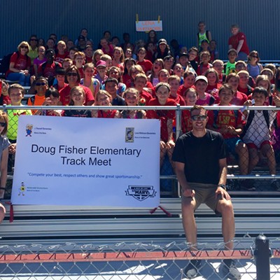 June 3, 2016 at the Moscow High School track. The school district's annual elementary track meet was officially named the Doug Fisher Elementary Track Meet. Coach Fisher, who taught physical education&nbsp;at Lena Whitmore Elementary School for 37 years passed away in March, 2016. Pictured are his 4th and 5th grade students at the all-district track meet along with his wife, Joy Fisher. Doug will be inducted into the 2016 Vandals Athletics Hall of Fame later this fall. Photo taken by Lisa Carscallen.