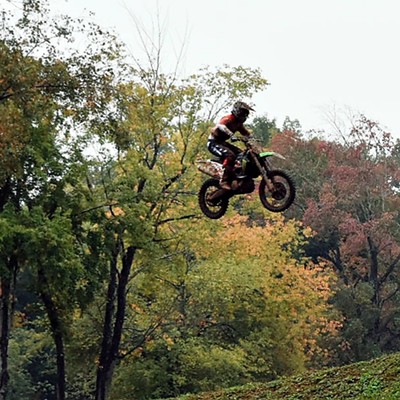 A professional motorcross rider flies during the Motorcross of Nations in Red Budd Michigan in October.