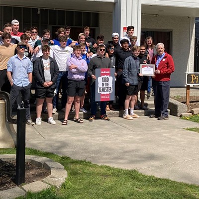 The College Hill Association and Pullman Mayor Glenn Johnson present the Fraternity Yard of the Semester award to chapter president Dennis Walsh and the members of Pi Kappa Alpha on Sunday, April 24, 2022. The chapter is located at 710 NE California Street in Pullman.