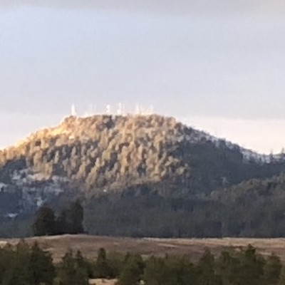 Sunset shines on West Twin Peak of Moscow Mountain on December 22, 2020. It was so cold that day that all of the towers are flocked and shining bright with ice. Normally the towers can not be clearly viewed by the naked eye but on this day they stood out. Photo by Karen Purtee, taken East of Moscow.