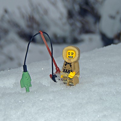 This image of a Lego figure going ice fishing was taken in the photographer's front yard in the Clarkston Heights in the morning of February 15, 2021 when the snow continued to accumulate.