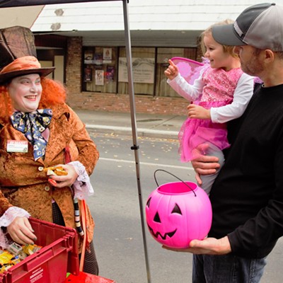 Our Granddaughter Lila was so excited meeting all the colorful costumed people in Clarkston, 2016. Taken by Mary Hayward of Clarkston.