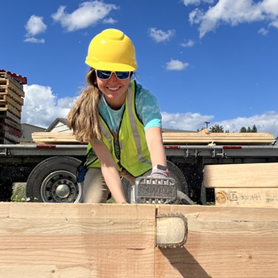 University of Idaho Architecture student Nathalia Campos-Oropeza trims beams to length June 21. The big glue-lam beams were donated by Rosoboro X-Beam for the house she is building with her classmates. The project is on land owned by the Moscow Affordable Housing Trust along E Palouse River Dr in Moscow. The house will be sold this fall to an income qualified family.