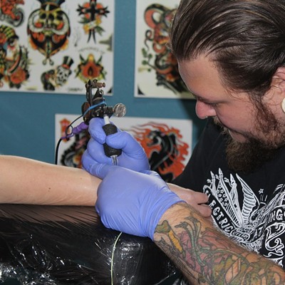 Photo by Hannah Quaglietta, local artist/tattoo artist. This photo was taken at Moscow Tattoo Company's grand opening event on July 1, 2018. Ian Ripley is a local tattoo artist.
    
    Hannah enjoys showcasing the artistic talents of others through photos.