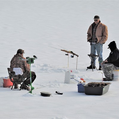 Several people ice fishing at Elk River Reservoir on January, 16, 2022.  They caught their third trout a couple minutes later.  They said the ice was between 16-24 inches thick.
