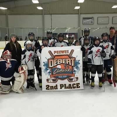 Lewiston's own LC Lightning Peewee hockey team battled it out with teams from Seattle, Tacoma, and Tri Cities at the 2015-2016 Desert Classic hockey tournament in the Tri Cities taking home a 2nd place championship banner. Pictured: Kai Tanata, Alexie Sugden (coach), Connor Short, Savannah-Jean Herbert, Jagger Hewett, Silas Elsberry, Saryn Elliot, Jaidyn McBride, Jared Jelinek, Andujar Perez, Avram Griswold, Esten Lee, Carson Sparks, and Dave Herbert (coach). Photo taken by Russ Elsberry on January 31, 2016, at the TRAC Pavilion, Pasco, Washington.