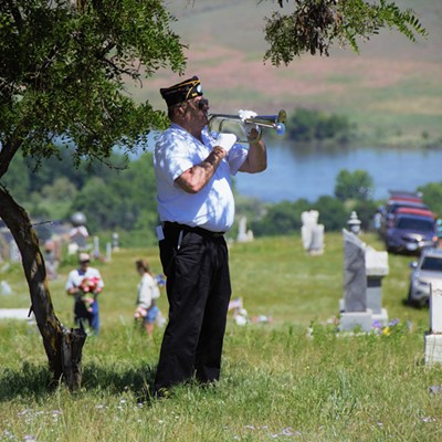 Mike Feil played the Taps for the American Legion Memorial Day Ceremony at the Asotin Cemetary, May 28, 2018. Photo by Mary Hayward.