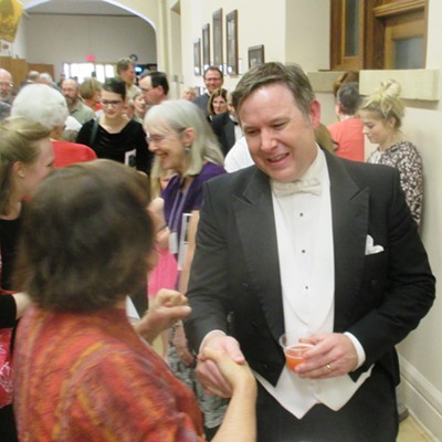 Michael Murphy of Moscow is congratulated by well-wishers after the April 17 performance of "Carmina Burana" by the Palouse Choral Society at the University of Idaho Administration Building auditorium.  Murphy is stepping down after seven years as artistic director and conductor of the regional chorale.  (Photo by Daily News reader Kenton Bird)