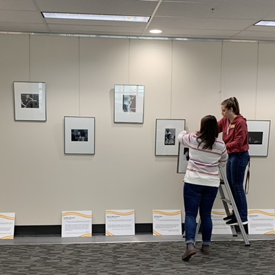 Archivists from the University of Idaho Library's Special Collections and Archives hang the Remarkable Jazzwomen at the Lionel Hampton Jazz Festival exhibit for next week's Jazz Fest. The exhibit is on the Library's second floor and will display through the month of April. l to r: Dulce Kersting-Lark and Sara Sara Szobody, both of Moscow.
