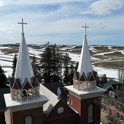 The twin spires of St. Boniface Catholic Church, Uniontown, Washington, with the crosses on top set against the backdrop of the disappearing snow from the Palouse landscape. This picture was taken on March 26, 2019 by Keith Collins.