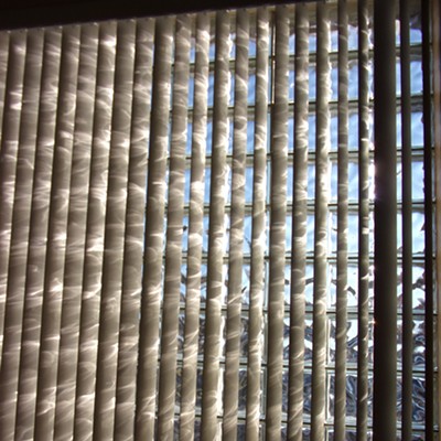 This combination of glass block window and vertical slats create visual excitement from inside the Genesee library. Taken on October 30th.