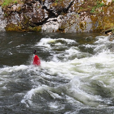 On a drive up the Lochsa River this kayaker looked as though his kayak was standing on its tail as he was beginning crest this roller and continue through the rapids. 
Photographed 5/8/2021 by Jerry Cunnington.