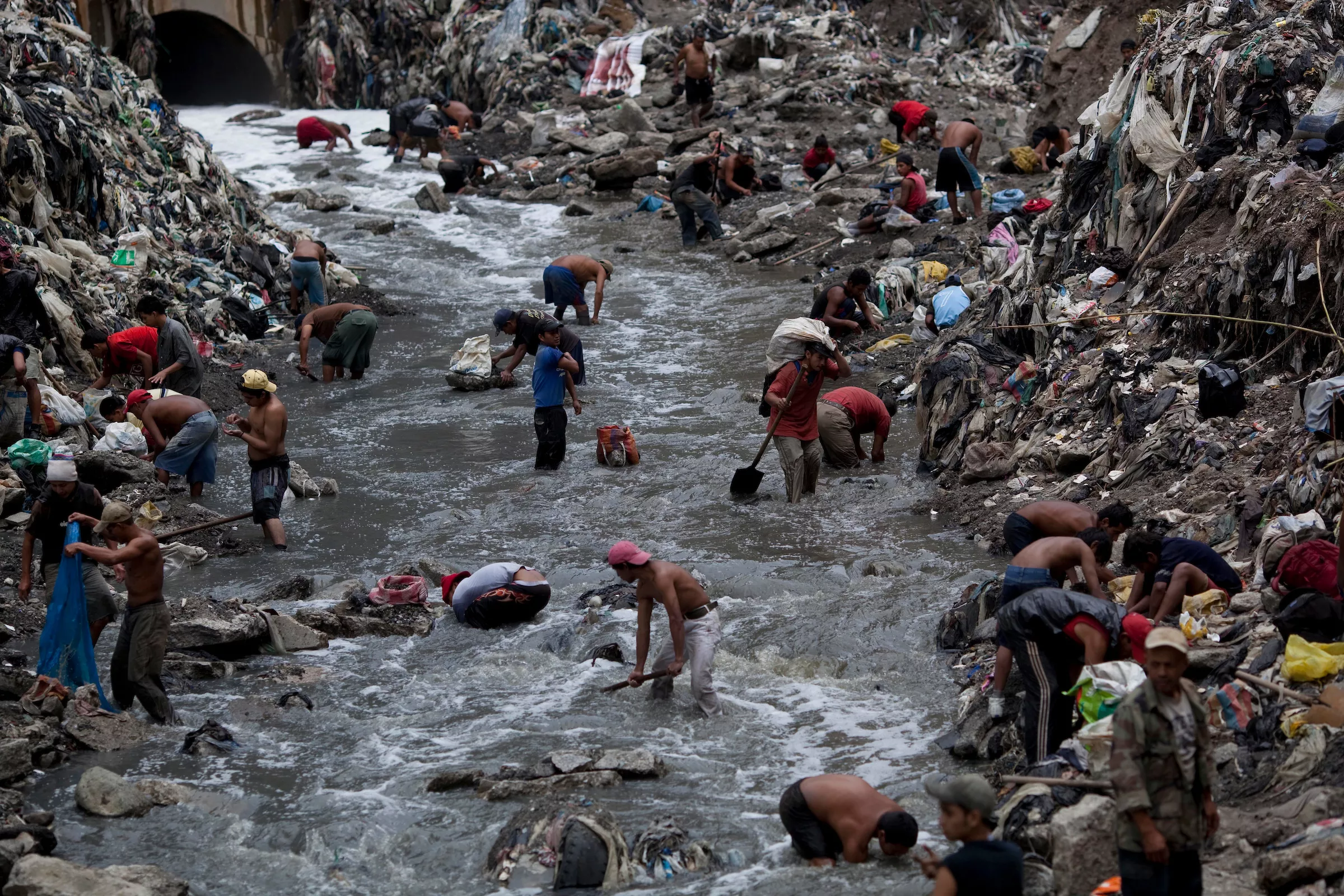People look for crap, bronze, gold and silver in the lowest section of the urban biggest dump also called as "Mine" is seen early morning, Guatemala City, Wednesday, Oct. 19, 2011. - AP PHOTO/RODRIGO ABD