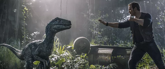 This image released by Universal Pictures shows Chris Pratt in a scene from, "Jurassic World: Fallen Kingdom." - UNIVERSAL VIA AP