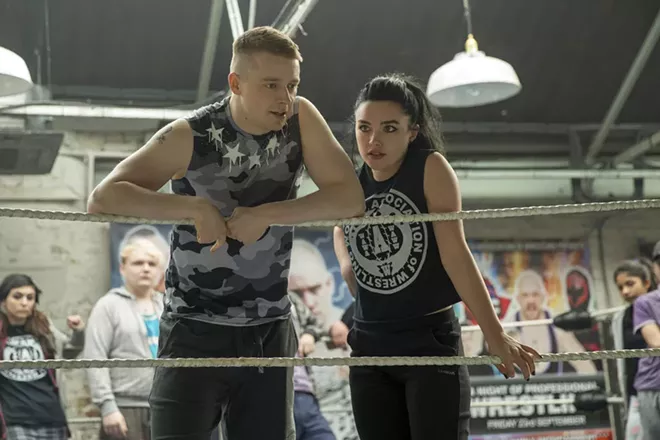 This image released by Metro Goldwyn Mayer Pictures shows Jack Lowden, left, and Florence Pugh in a scene from "Fighting with My Family." - ROBERT VIGLASKY/METRO GOLDWYN MAYER PICTURES VIA AP