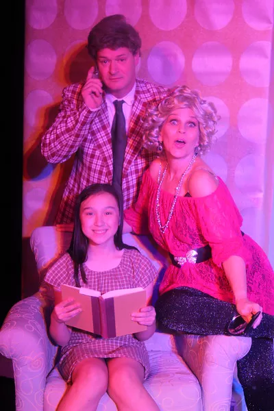 Ben Edgerton and Laura Child play Mr. and Mrs. Wormwood with Natalie Clark as Matilda in the Regional Theatre of the Palouse production “Matilda.” Matilda is also played by Lorelei Rideout.