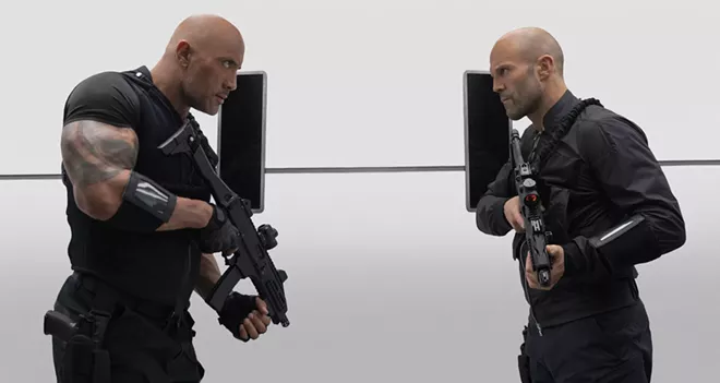 This image released by Universal Pictures shows Dwayne Johnson, left, and Jason Statham in a scene from "Fast & Furious Presents: Hobbs & Shaw." - AP