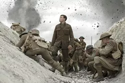 This image released by Universal Pictures shows George MacKay, center, in a scene from "1917," directed by Sam Mendes. (François Duhamel/Universal Pictures via AP) - FRANÇOIS DUHAMEL/UNIVERSAL PICTURES VIA AP