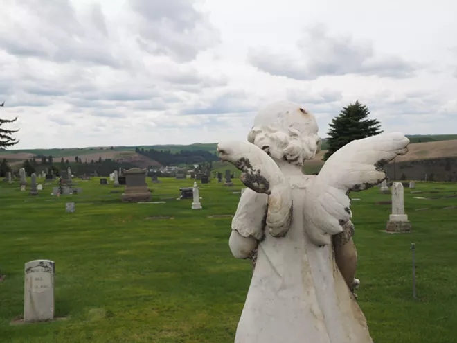 An angel statue on a child's grave overlooks the Colfax Cemetery. Tara Roberts/for Inland 360 - TARA ROBERT/INLAND 360