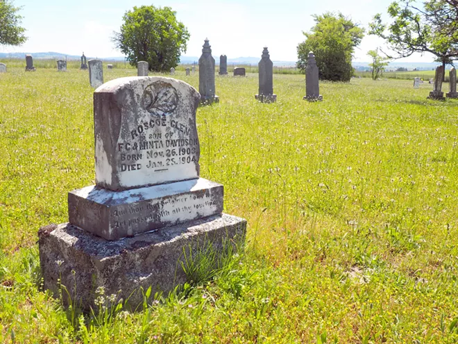 An infant's grave from the turn of the 20th century stands near the entrance to Wild Rose Cemetery outside Kendrick. Tara Roberts/for Inland 360 - TARA ROBERTS/INLAND 360