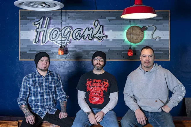 Band members of the Maple Bars, Nathan Golla (left), Mason McCroskey (center) and Laki Ah-Hi, pose for a portrait inside Hogan's Pub in Clarkston. - PETE CASTER/TRIBUNE
