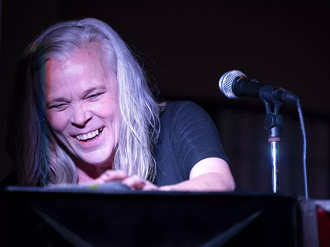 Sherry Lukenbill laughs while getting a large applause after singing an Etta James cover during the second half of her set she was performing with her husband, Marty, at Brock’s on Friday, April 23, in downtown Lewiston. - PETE CASTER/360