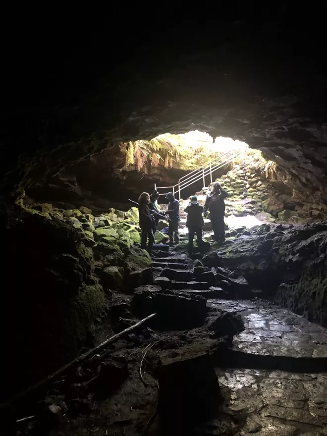 Cinematographer Jonny Kristopherson and other assistants at the entrance of the Ape Cave at Mount St. Helens for the filming of "Harmony Falls." - CONTRIBUTED PHOTO