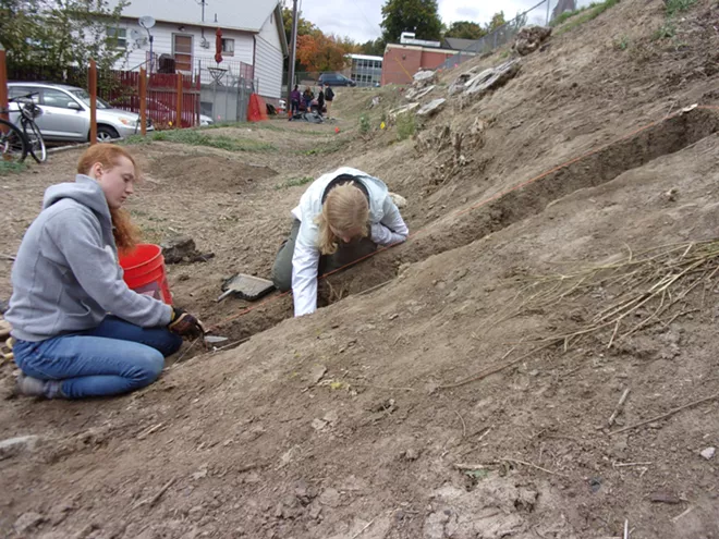 University of Idaho students Moira Riggs and Josee Grant excavate a trench at Moscow High School as part of an Idaho Public Archaeology community-based dig. - MARK WARNER