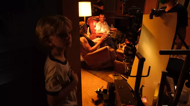 Connor Cruz Stout waits for his cue as lighting is adjusted on Nathanael Tucker and Eric Taylor. - DAN BLAKNEY