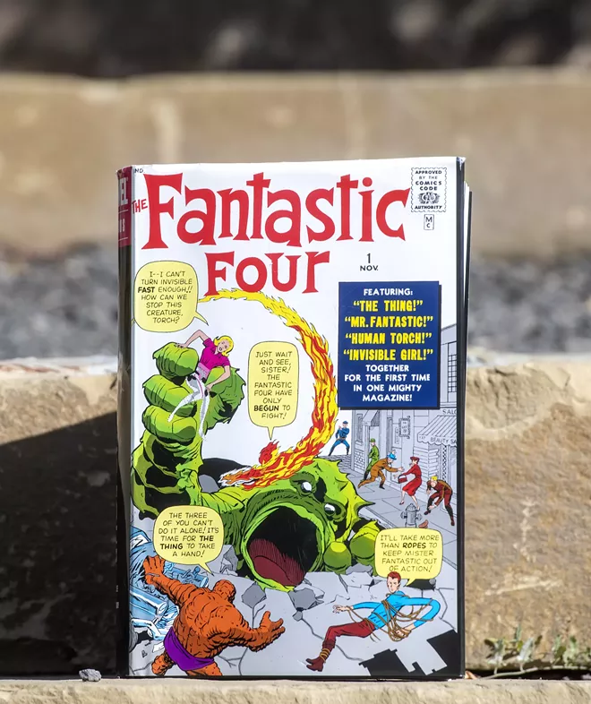 A Fantastic Four volume one omnibus sits on a set of steps at the University of Idaho Arboretum and Botanical Garden on Friday afternoon, Oct. 1, 2021. - ZACH WILKINSON/INLAND 360