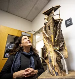 Rachel Jameton looks over one of the first pieces she made at her office at Lewis-Clark State College.