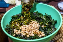 Winn prepares a kale salad at her home on Monday. - AUGUST FRANK/INLAND 360