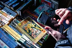 Baney does a quick internet search to assess the value of an item at a recent sale. - AUGUST FRANK/INLAND 360