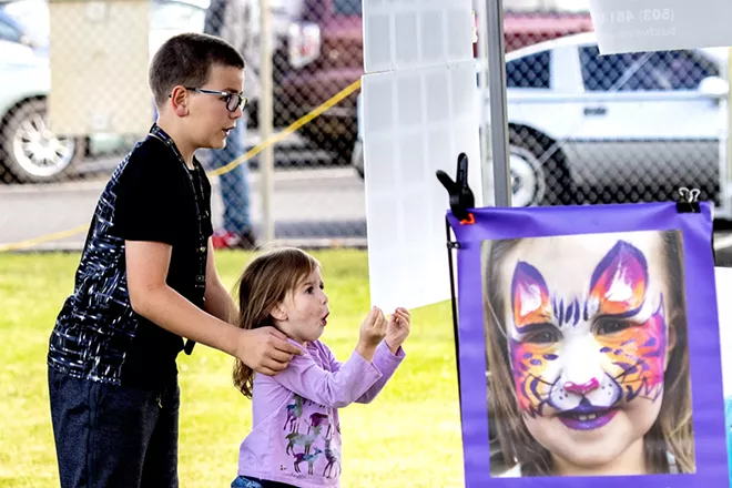 Noelle Mallett, 3, reacts to various face paints she can get while her brother, Austin Mallett, 10, looks over the options next to her at a Lewiston Food Truck Night at the Nez Perce County Fairgrounds. - AUGUST FRANK/INLAND 360 FILE