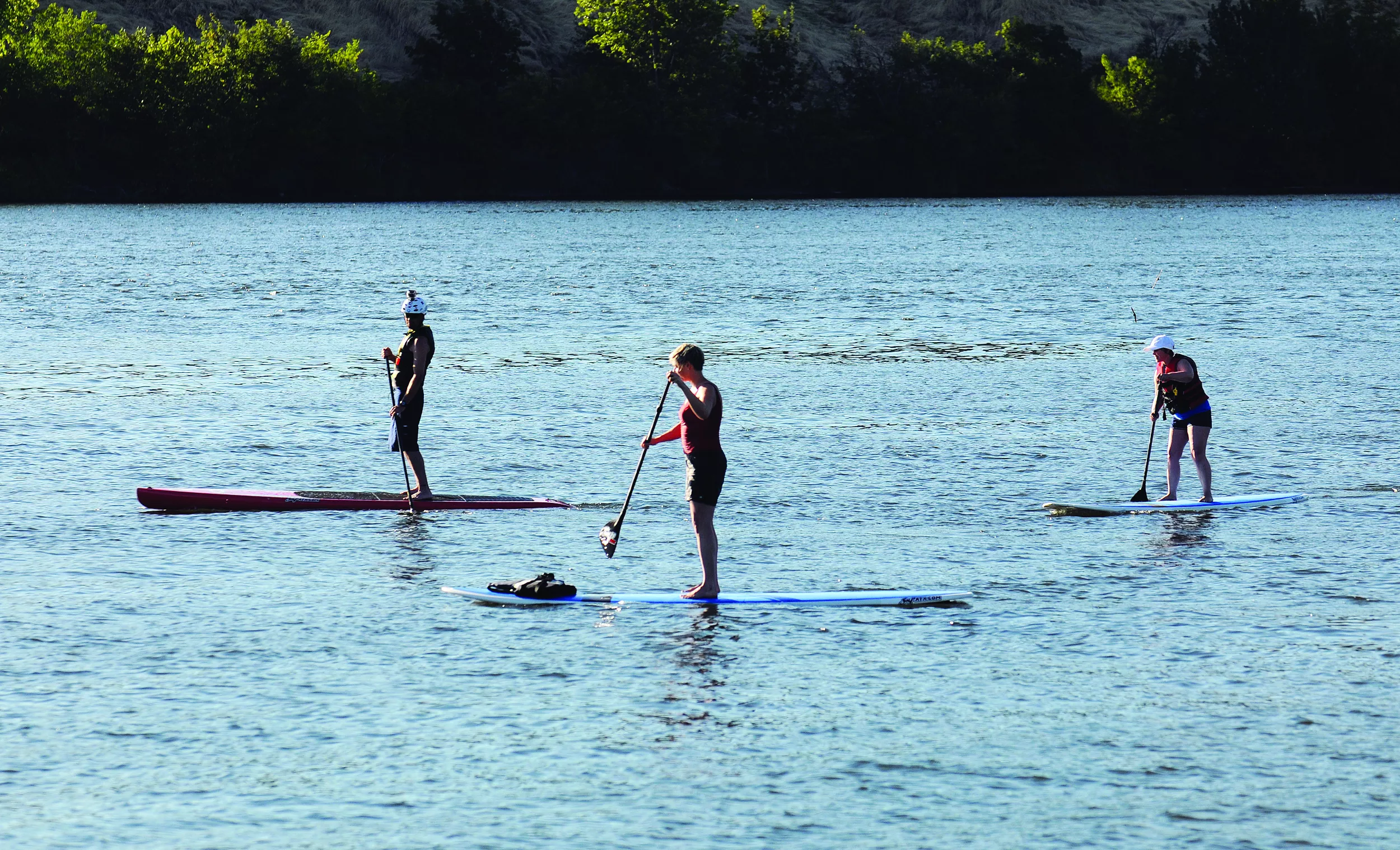 Strolling on the River Stand up paddleboarding is growing in