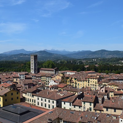 Looking northwest, this is a view of the Italian city of Lucca in Tuscany on August 24. The photo was taken by Bob Woods of Moscow from the Torre Guinigi Tower in the old portion of the city, which is completely surrounded by a wall that served to defend the city from attack hundreds of years ago. On the top of the wall is a paved path that is used for walking and biking. The modern portion of the city outside the wall has a population of around 80,000. The mountains in the far distance are an important source of marble.