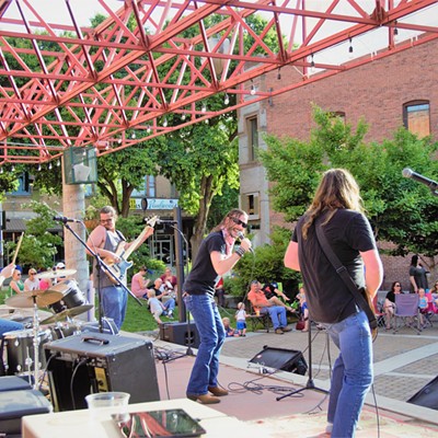 The band, The Hitmen, performed for a large audience at Brackenbury Square June 2, 2017. Taken by Mary Hayward of Clarkston.