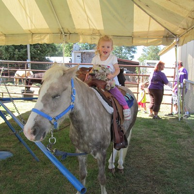 Raelynn Polumsky- 2- was riding her first horse at the fair- She was very excited- She is the daughter of Matt and Brandi Polumsky and her mother took the photo