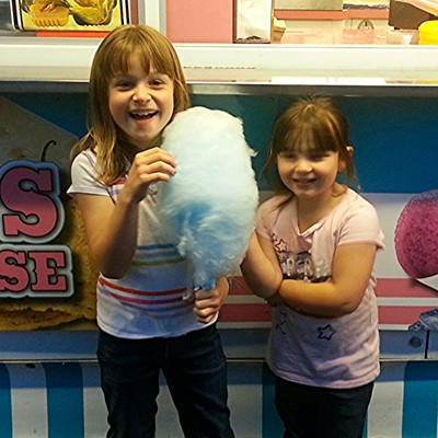 Emma Hemphill, 7, and sister Josey Hemphill, 4, of Lewiston, enjoy some cotton candy at the Asotin Country Fair Friday, April 24th. Parents &nbsp;are Matthew and Jeanette Hemphill. Photo by Grandpa Dan Again of Lewiston.