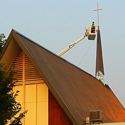 Construction workers put finishing touches on steeple at Our Saviors Lutheran in Clarkston. Thursday August 23.
    Photo by Dan Aeling of lapwai