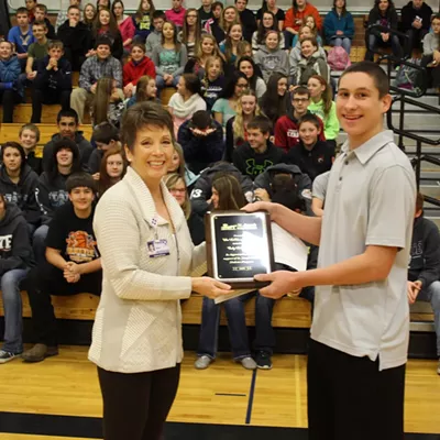 Pomeroy High School sophomore Cort LaMunyan, right, hands a check for $2,018.78 to Susan Rauch of the Juvenile Diabetes Foundation at a school assembly Dec. 15. The donation will go to the foundation at St. Joseph&#146;s Regional Medical Center and to the Shriner&#146;s Hospital in Spokane. Rauch in turn presented a plaque of appreciation to the LaMunyan family for their support of the Foundation. Cort helped raise the money by planning, organizing and carrying out two youth basketball tournaments in Pomeroy in November. Cort&#146;s brother, Cody, a freshman at Washington State University, who was diagnosed with diabetes at the age of 15, conceived and implemented the idea for the tournaments two years ago. Cort is carrying on the tradition in his name. Cort has been a patient at the Shriner&#146;s Hospital (as have many Pomeroy families) and has benefitted from their generosity. Cort is the son of Jan Baune and Doug LaMunyan. (Mike Tom photo)