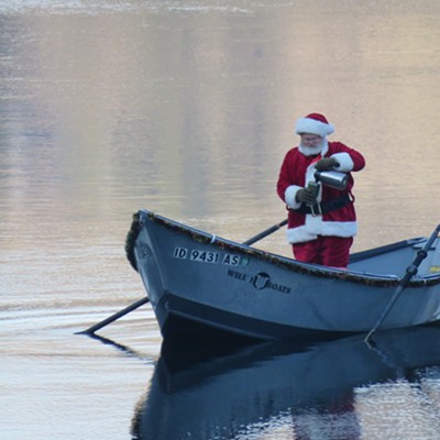 Le Ann Wilson caught Santa Claus sneaking in a little bit of holiday angling. Old St. Nick - in a decorated row boat - came prepared with a potful of piping hot coffee to ward off the winter chill. The photo was taken November 30 a few miles west of Orofino.