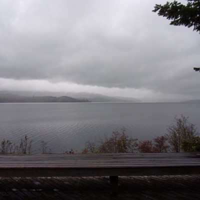 On October 13th the middle section of Lake Couer d'Alene was dark
and peacefully gloomy in the early afternoon as seen from Camp N-Sid-Sen.